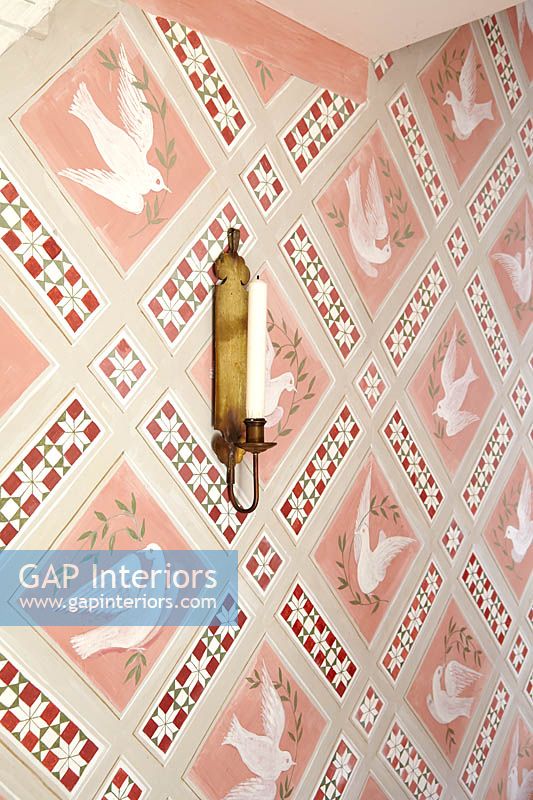 Decorative wallpaper with candle sconce