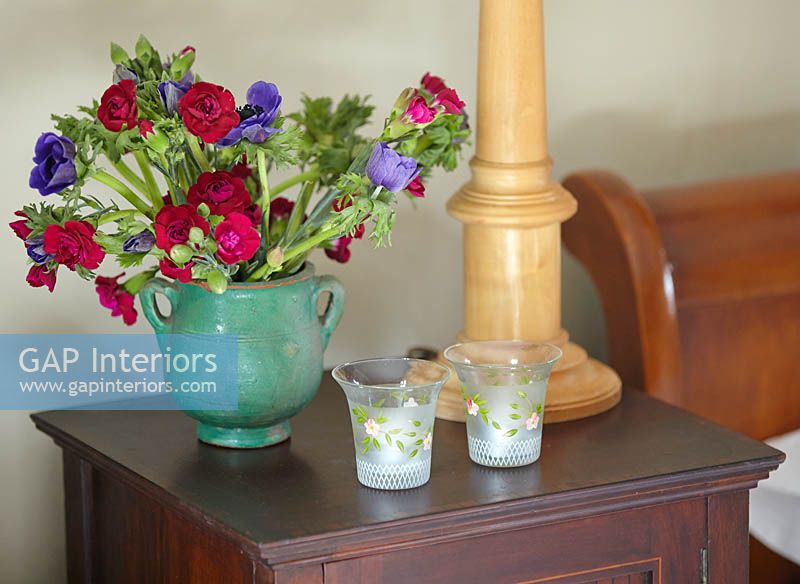 Colourful flowers on bedside cabinet