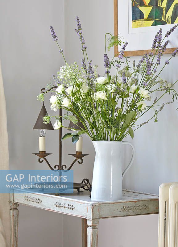 Roses and Lavender flowers in white jug