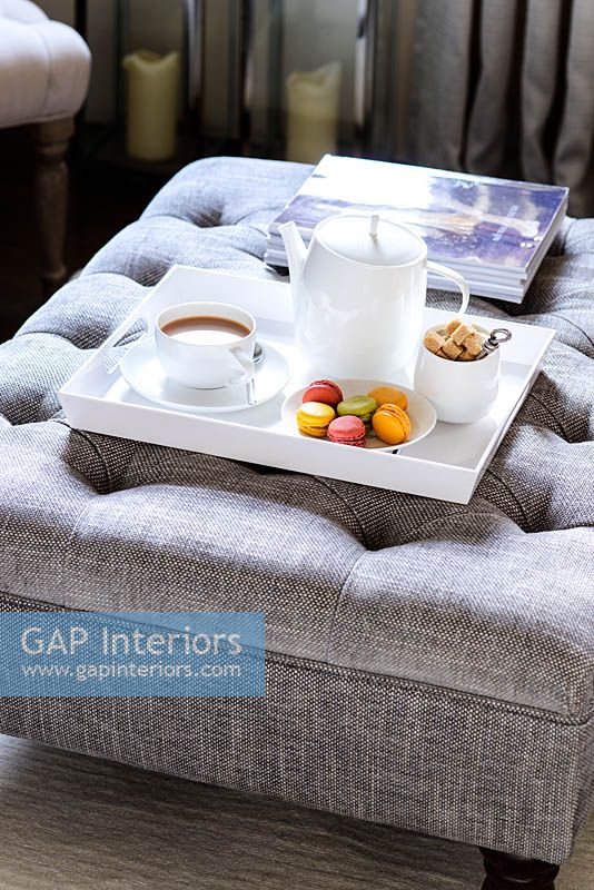 Tea tray on grey ottoman