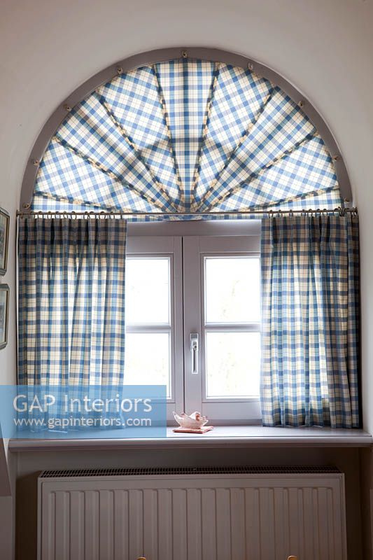 Arched window with curtains
