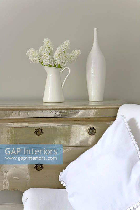 Jug of white Hyacinths on silver chest of drawers