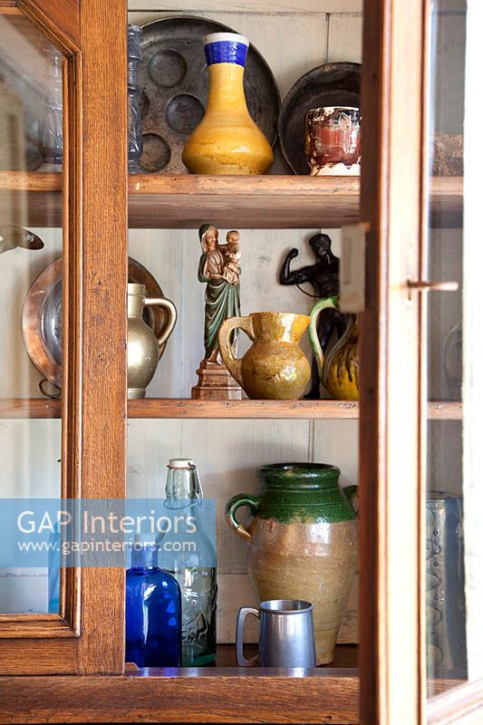 Ceramics display in wooden cabinet
