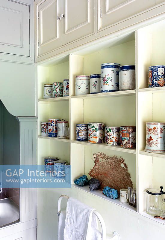 Display of patterned ceramics on bathroom shelves