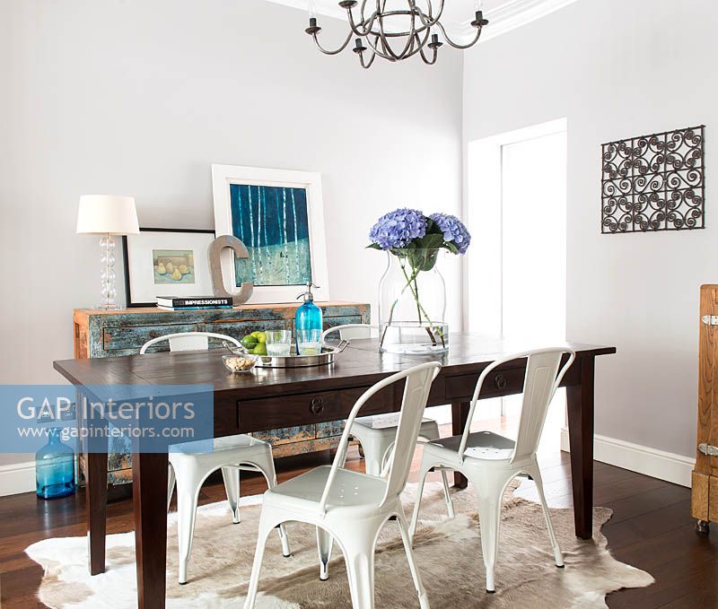 Metal chairs at dining table