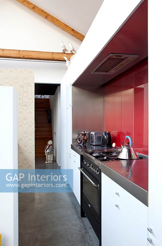 Oven with red splashback
