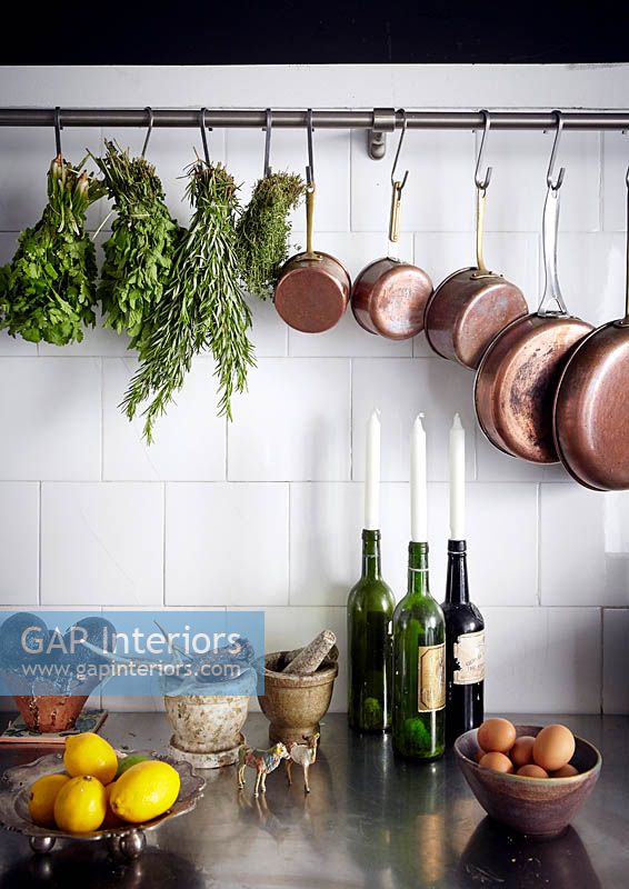 Cooking equipment hanging from rail