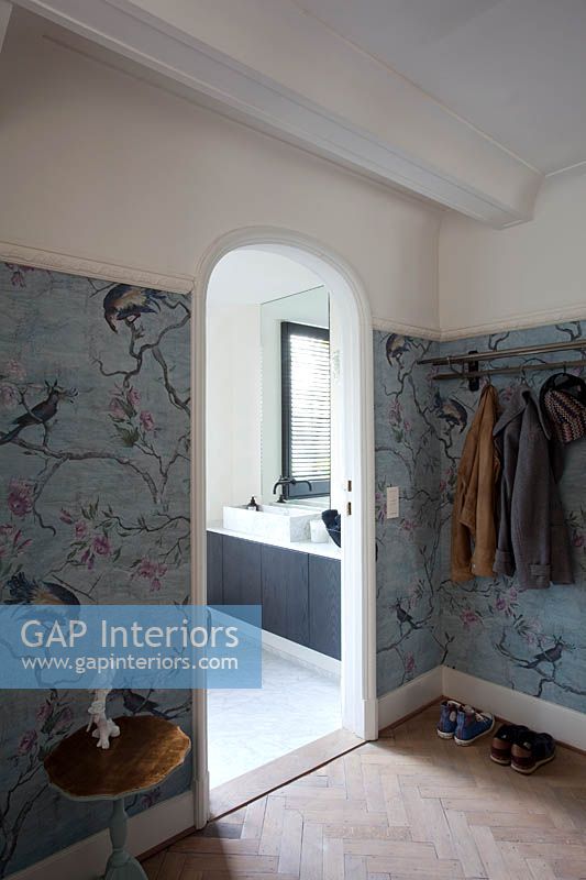 Hallway with patterned wallpaper