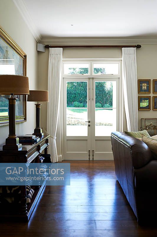 Patio doors with white curtains