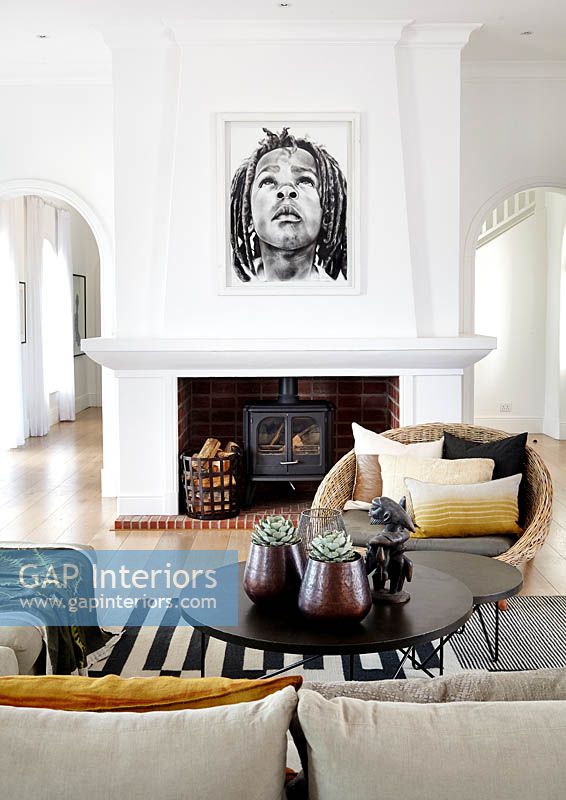 Portrait painting above fireplace