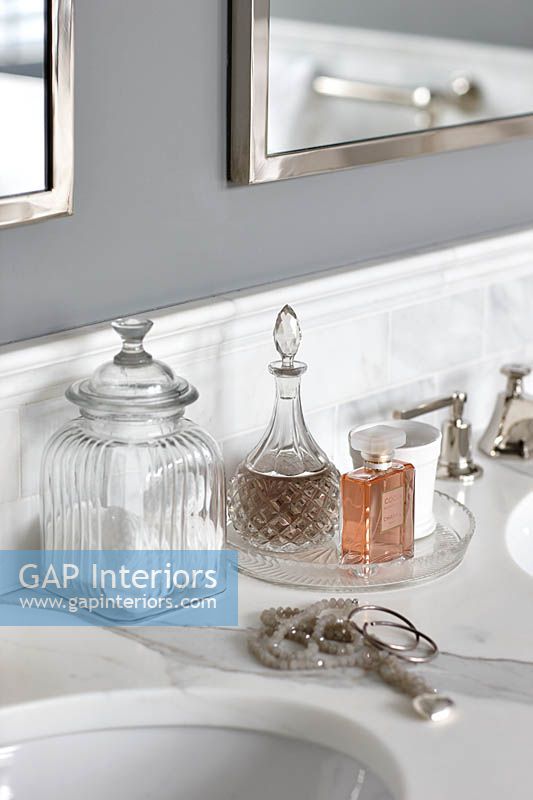 Glass accessories on bathroom surface