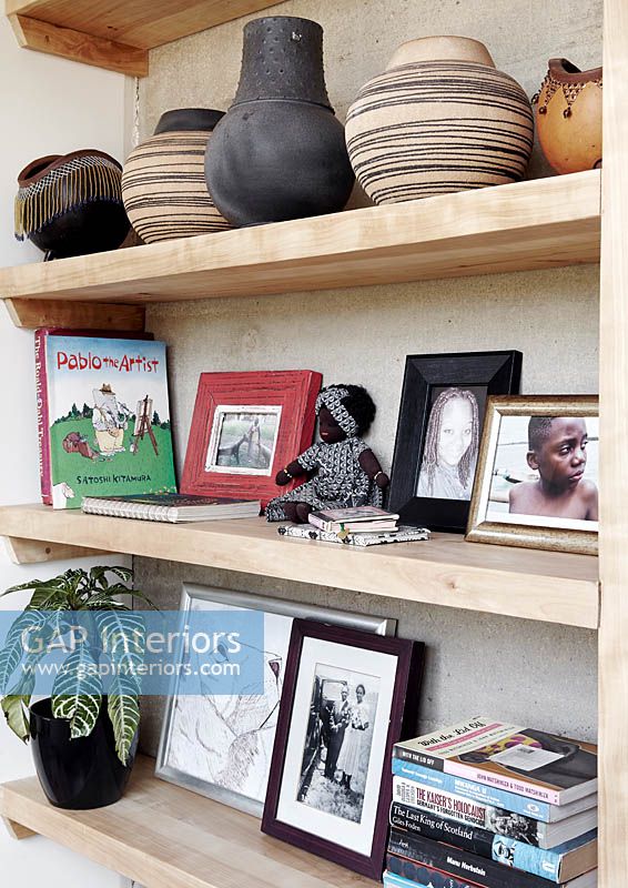 Accessories on wooden bookcase