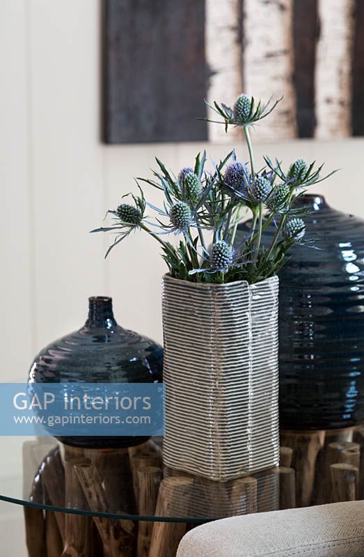 Seaholly flowers in striped vase