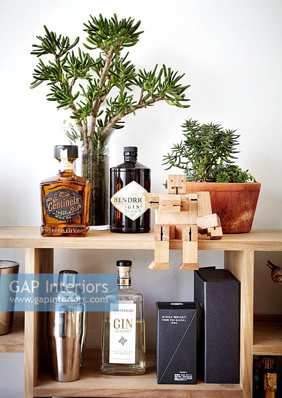 Drinks accessories on wooden shelving unit