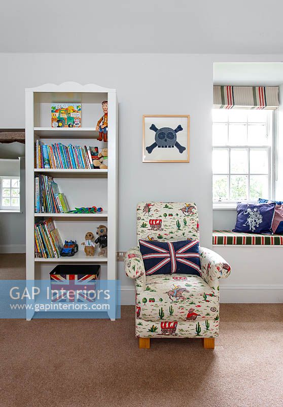 Patterned armchair in childs bedroom
