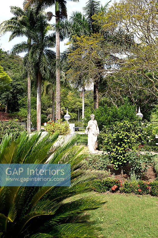 Tropical garden with statues