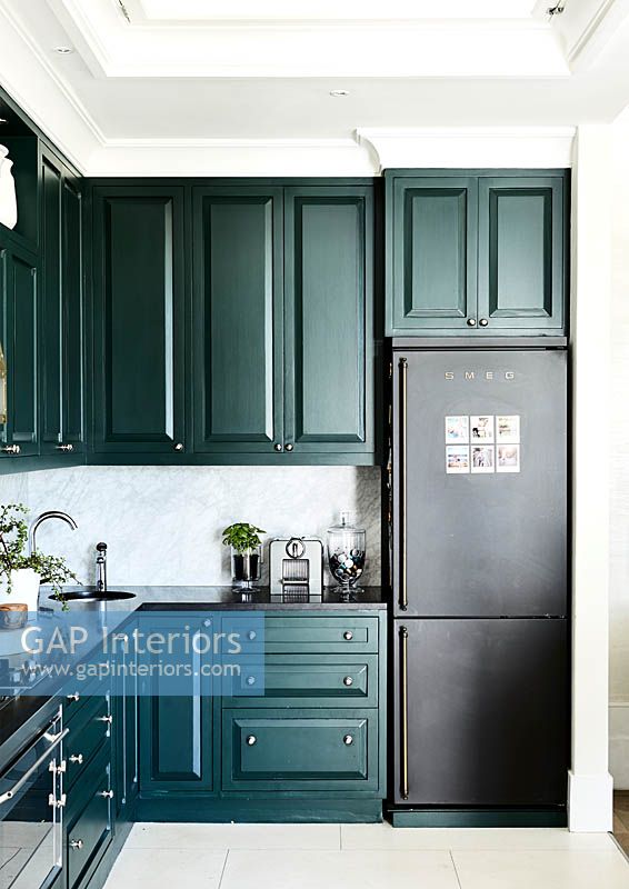 Dark green kitchen units