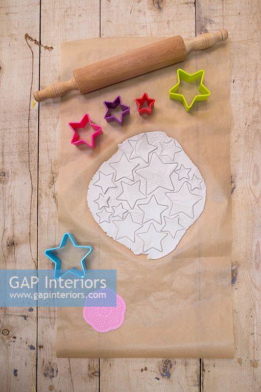 Making clay stars - a variety of different sized stars cut out from the modelling clay 