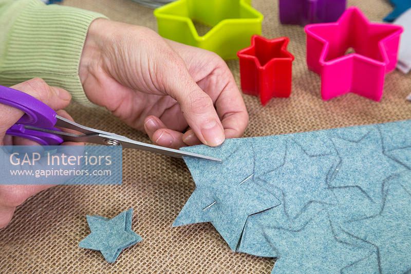 Making a felt christmas tree - Cut out the stars following the pencil guideline