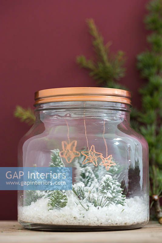 Making copper wire stars - finished decorations hanging inside a miniature Christmas themed glass jar