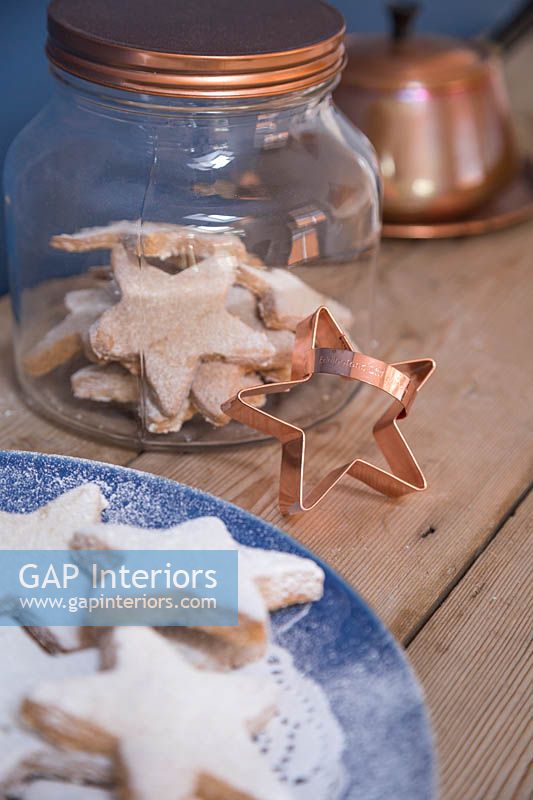 Christmas shortbread stars with a copper star cookie cutter 