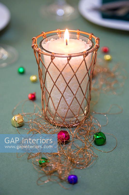 Candle inside copper candle holder, with miniature baubles and copper thread 
