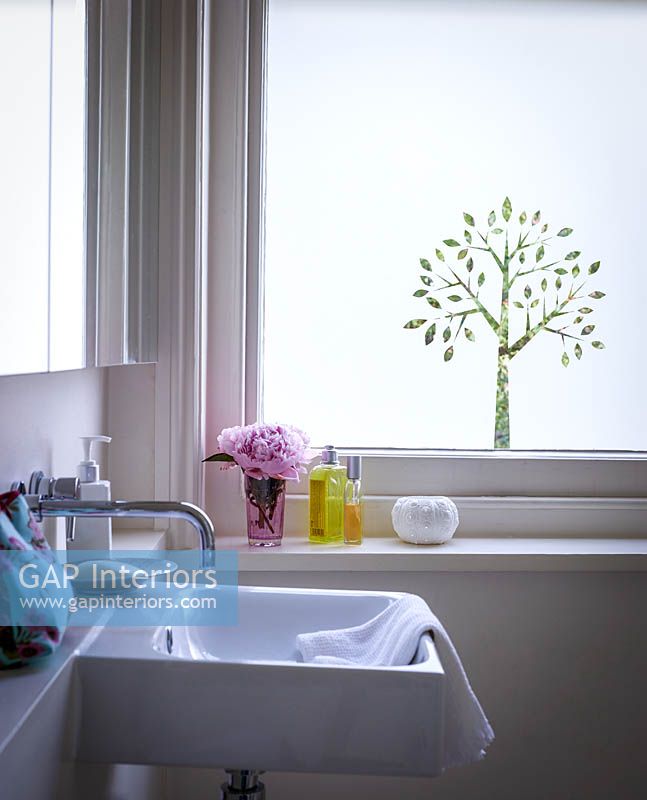 Bathroom window with decorative film