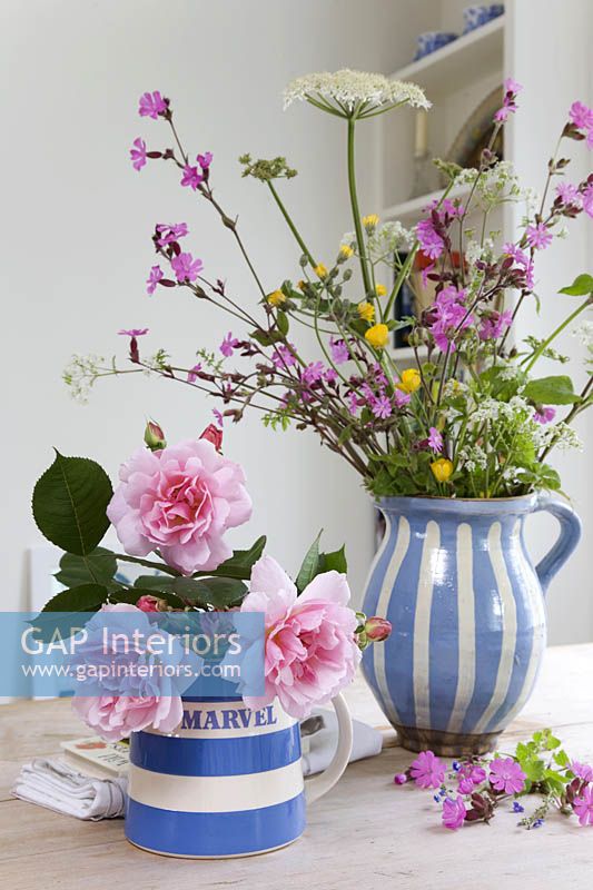Flowers in patterned jugs