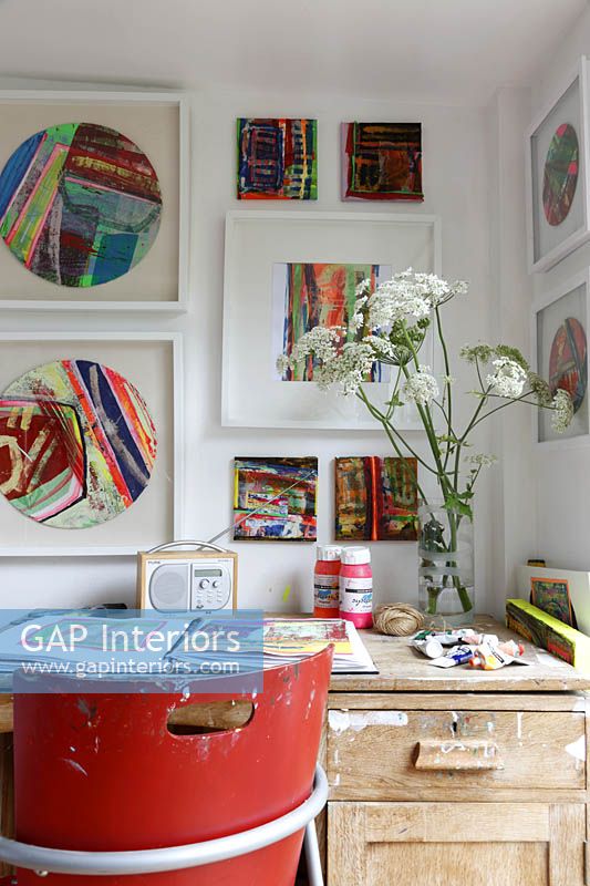 Artists desk with colourful art display