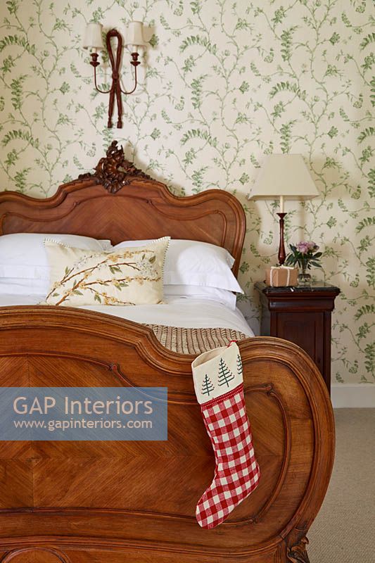 Ornate bed with christmas stocking