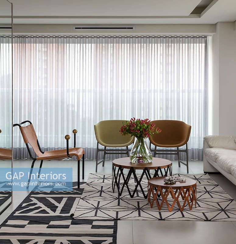 Open plan seating area with patterned rugs