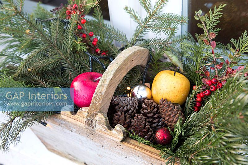 Christmas decorations in wooden trug