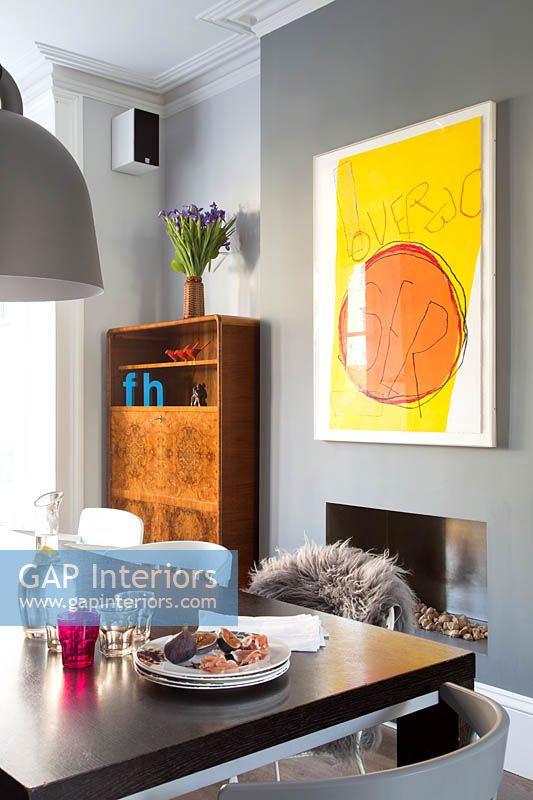 Colourful art on dining room wall