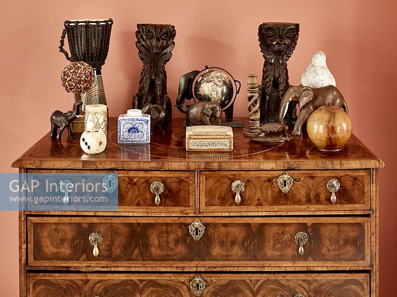 Collectibles on chest of drawers