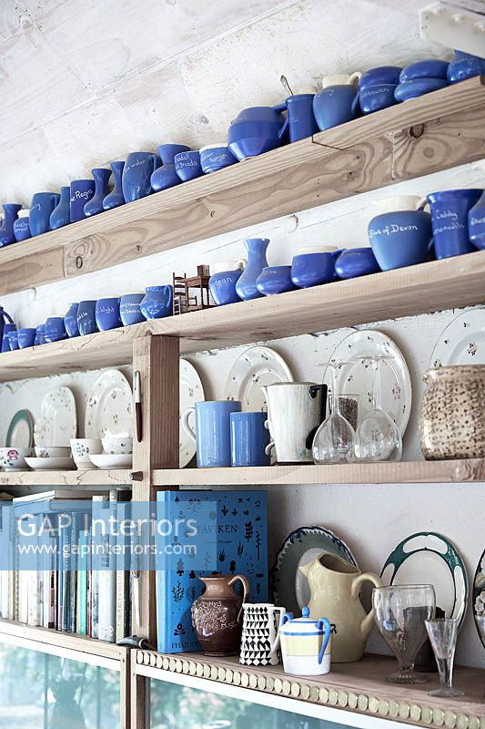 Ceramics display on wooden shelves