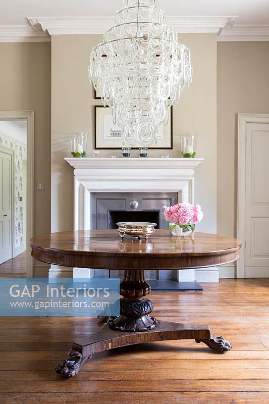 Modern chandelier above classic table