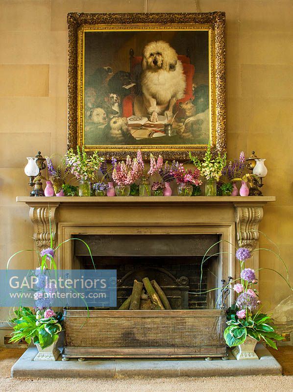 Floral display on mantlepiece at the north entrance with jars of Lupin, Astrantia, Campanula, Digitalis, Mint and Millet