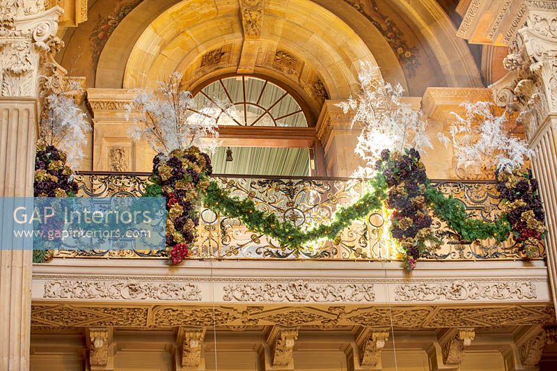 Christmas decorations including asparagus fronds on the great hall balcony, Castle Howard