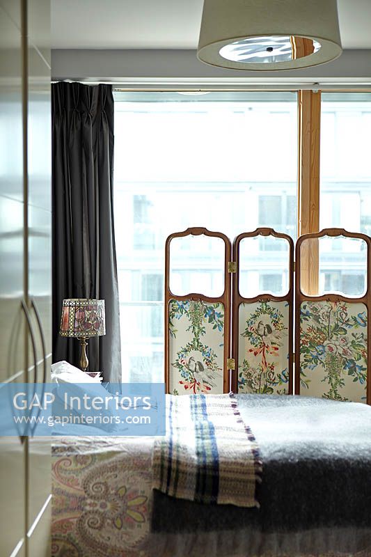 Patterned screen at bedroom window