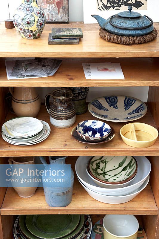 Patterned ceramics on wooden shelves
