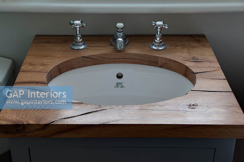 Bathroom sink with wooden surround