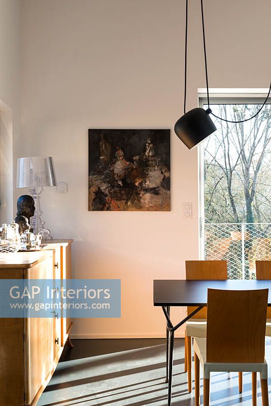 Modern painting on dining room wall