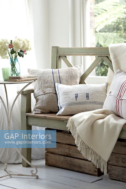 Cushions on wooden bench