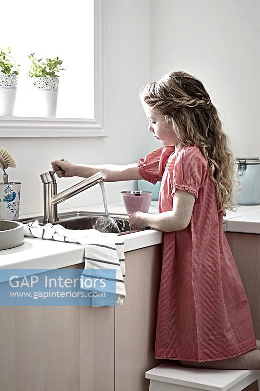 Girl using sink