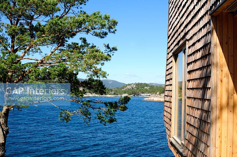 Modern, larch clad cabin overlooking sea