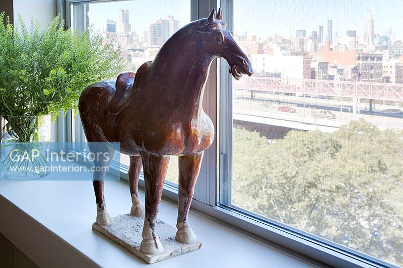 Horse sculpture on windowsill