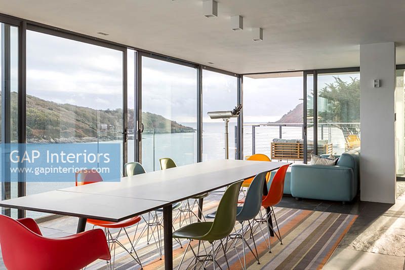 Colourful dining area overlooking sea