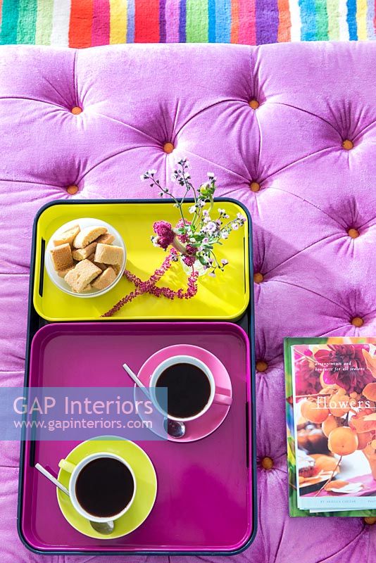 Coffee and biscuits on colourful tray