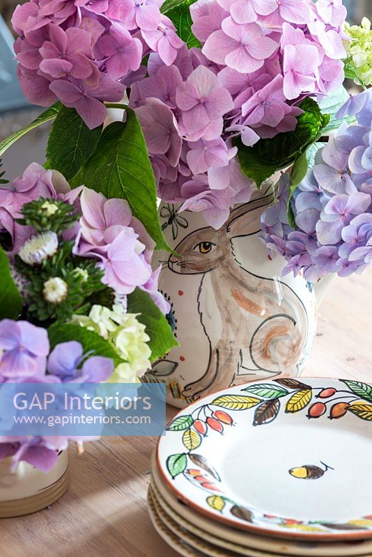 Vase of Hydrangea flowers on kitchen table