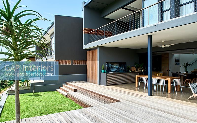 Contemporary house with covered dining area